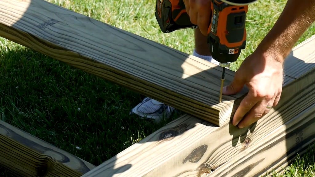drilling joists for diy backyard swing set