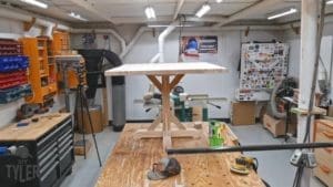 pedestal game table resting on workshop table