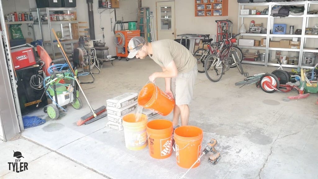 man pouring water into bucket for DIY concrete mix