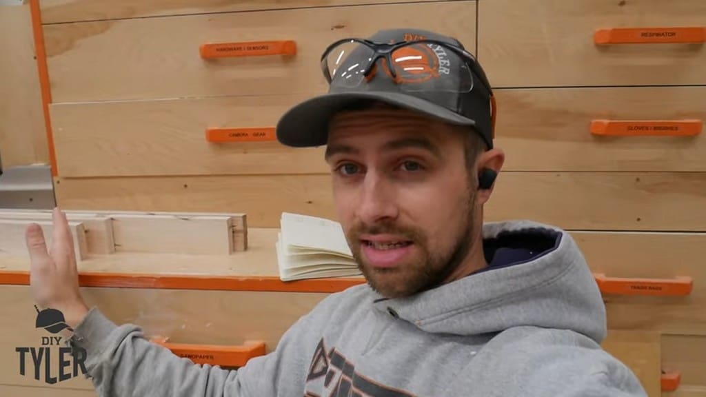 man standing in front of milled maple wood pieces