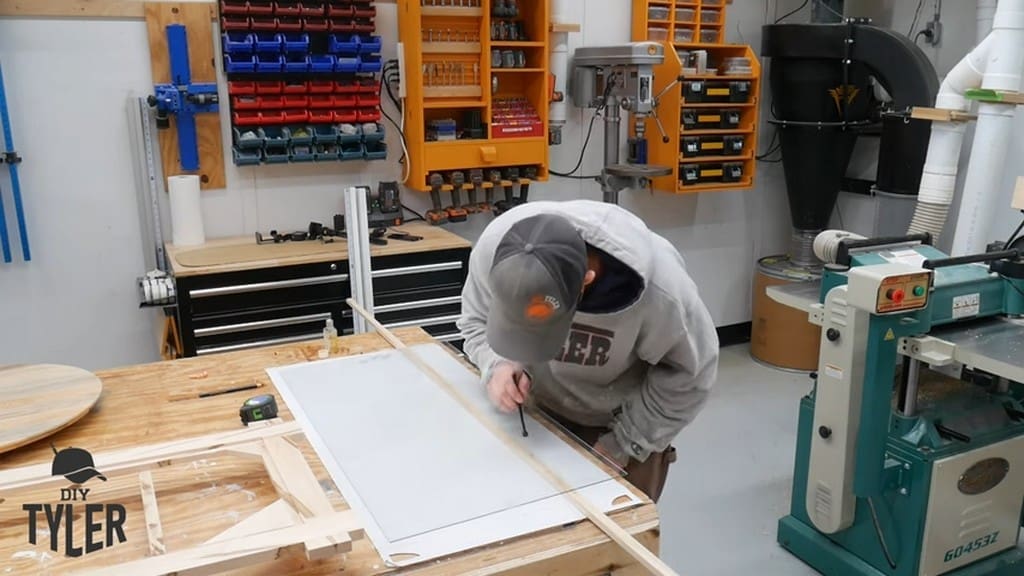 man tapping edge of glass