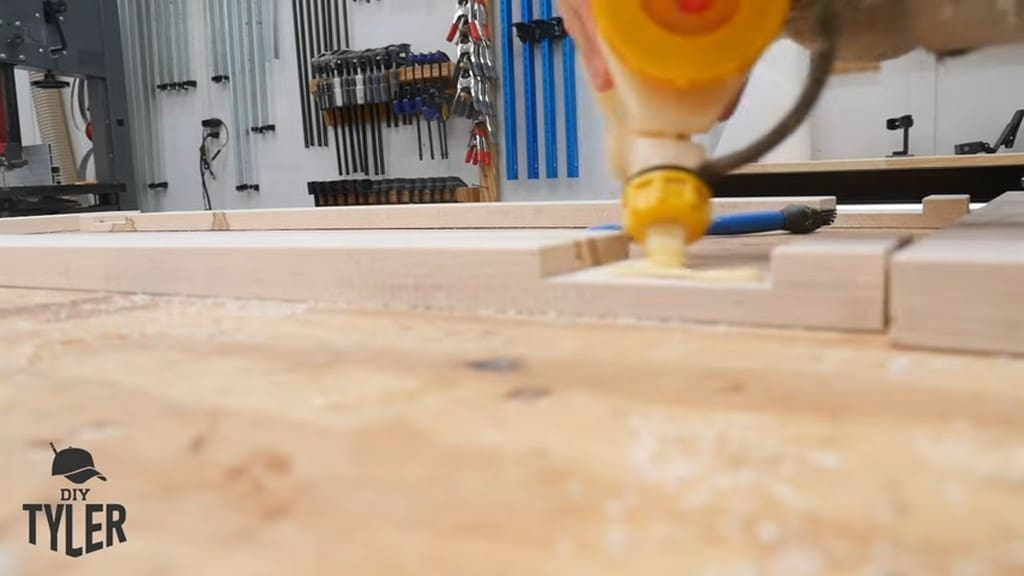 man applying wood glue to half-lap wood joint
