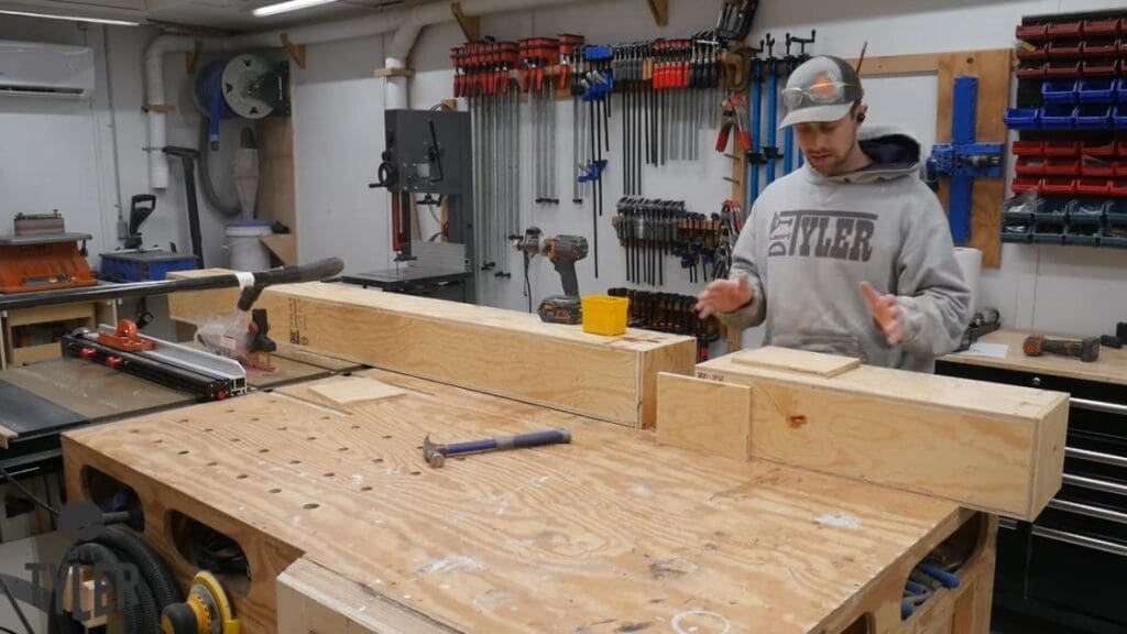 man gesturing to pieces of steam box for steam bending wood