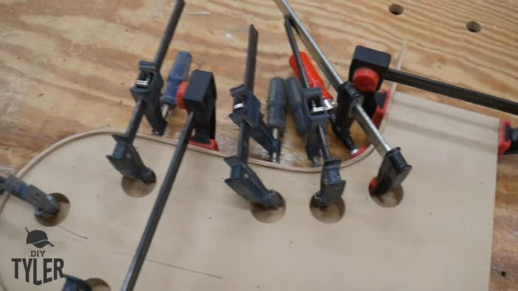 f-clamps holding bent steam-treated wood onto mold