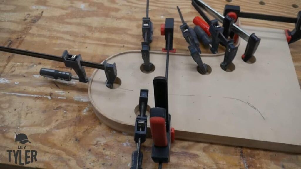 f-clamps holding bent steam-treated wood onto mold